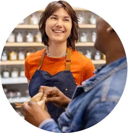 Young woman interacting with a customer.